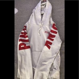 white and red sweatshirt from pink